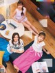 A group of young women sitting on top of a couch.